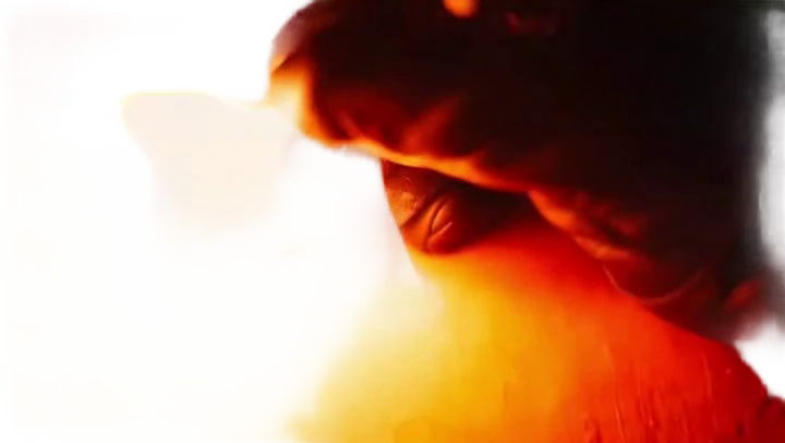 man-in-sunglasses-burning-a-lett-man-in-dark-sunglasses