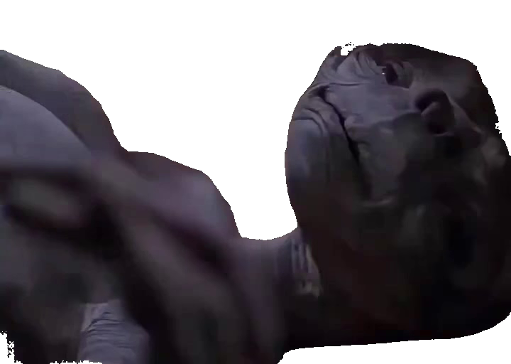 Gray alien on bed