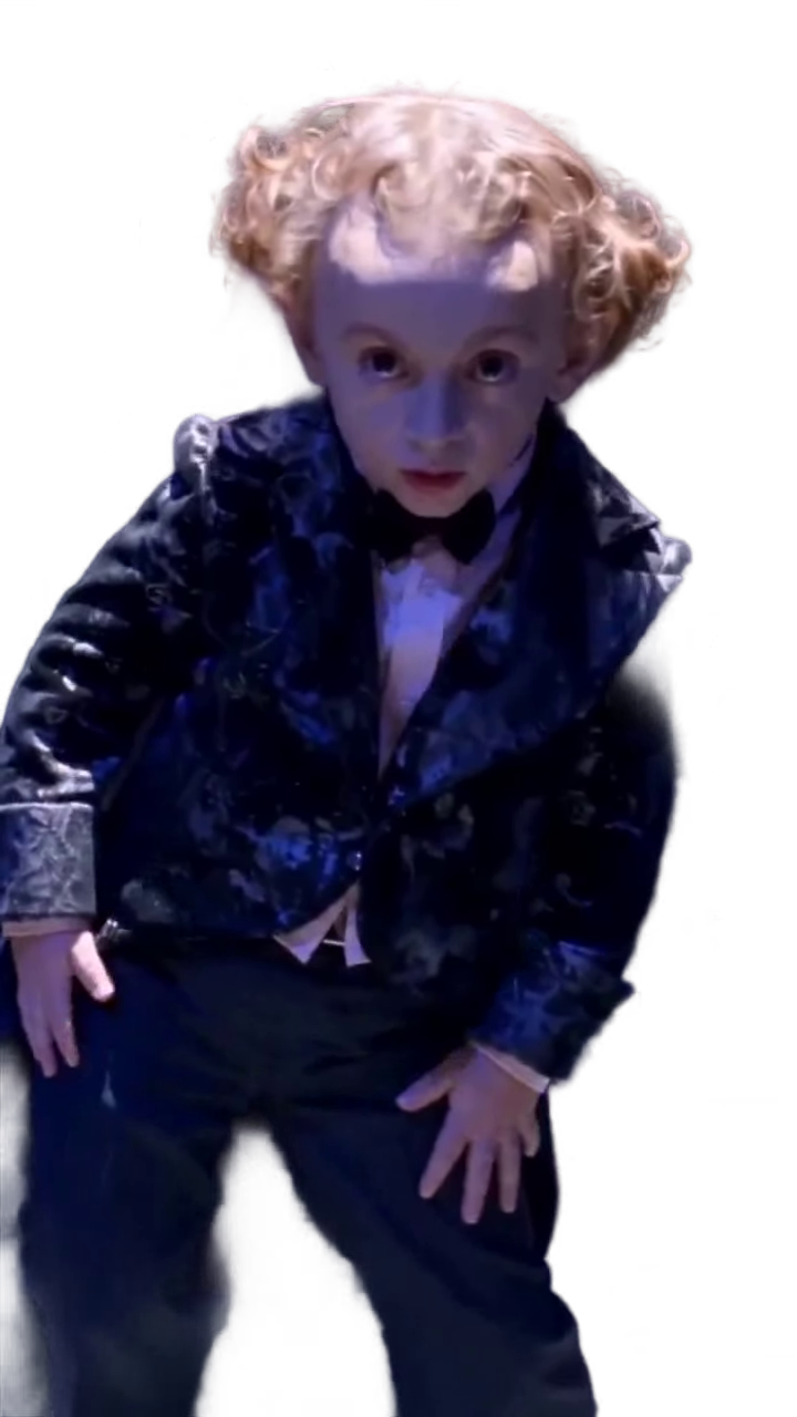 tiny-man-in-tuxedo-staring-up-tiny-man-in-tuxedo